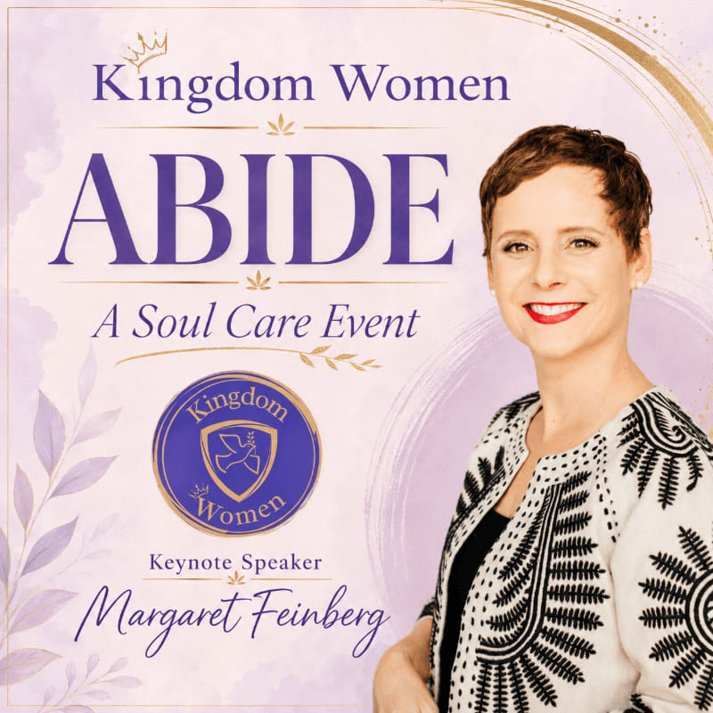 A smiling woman with short brown hair is featured in the foreground, while the background displays text announcing "Kingdom Women ABIDE A Soul Care Event" and a logo.