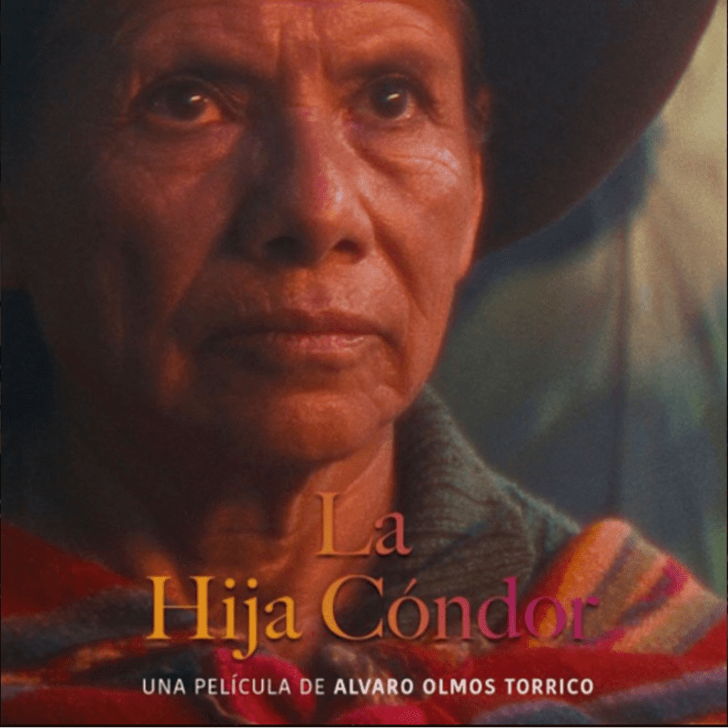 A close-up of an elderly woman's face, wearing a hat and a colorful woven garment, is set against a softly blurred background with text overlay.