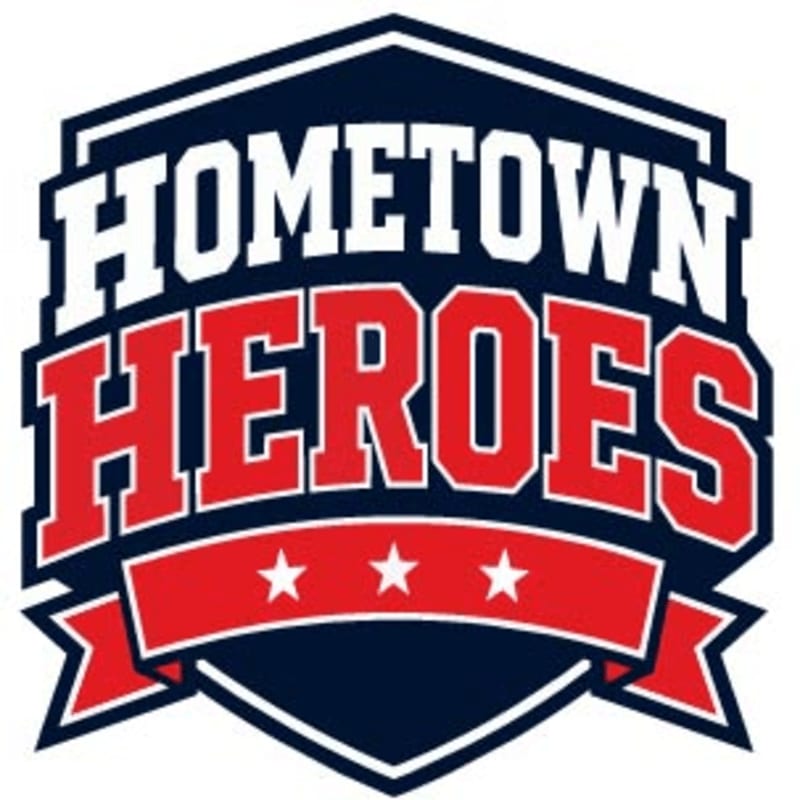 A dark blue and white hexagonal logo with "HOMETOWN HEROES" in large red and white letters is centered on a white background.