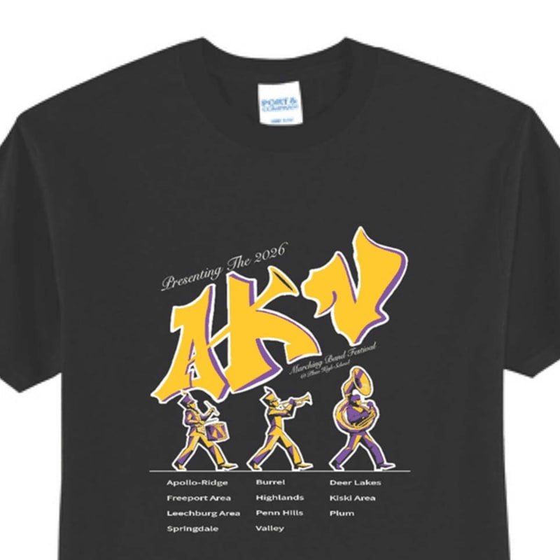 A black t-shirt displays a graphic of three cartoon band members in the foreground and a list of school names in the background.