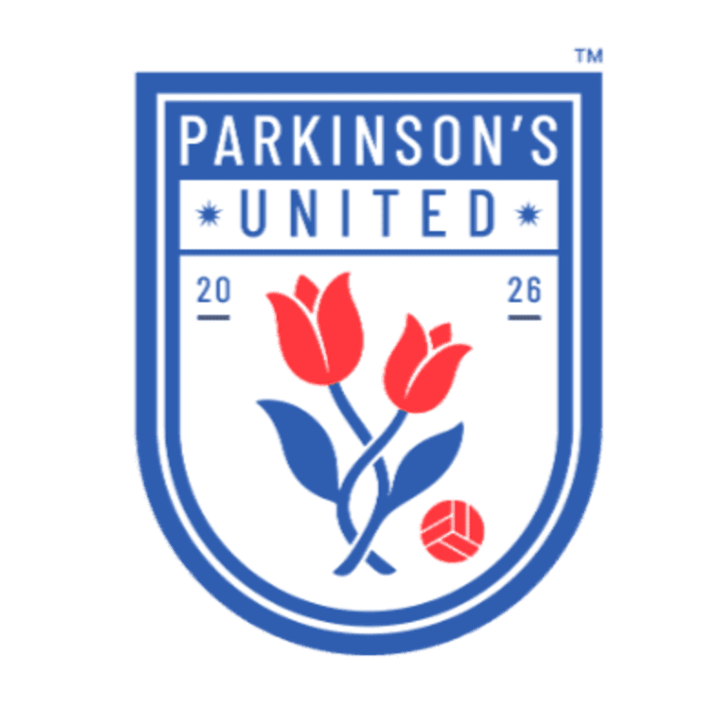 A blue and white shield logo features two red tulips and a soccer ball in the foreground, with "PARKINSON'S UNITED" text above in the background.
