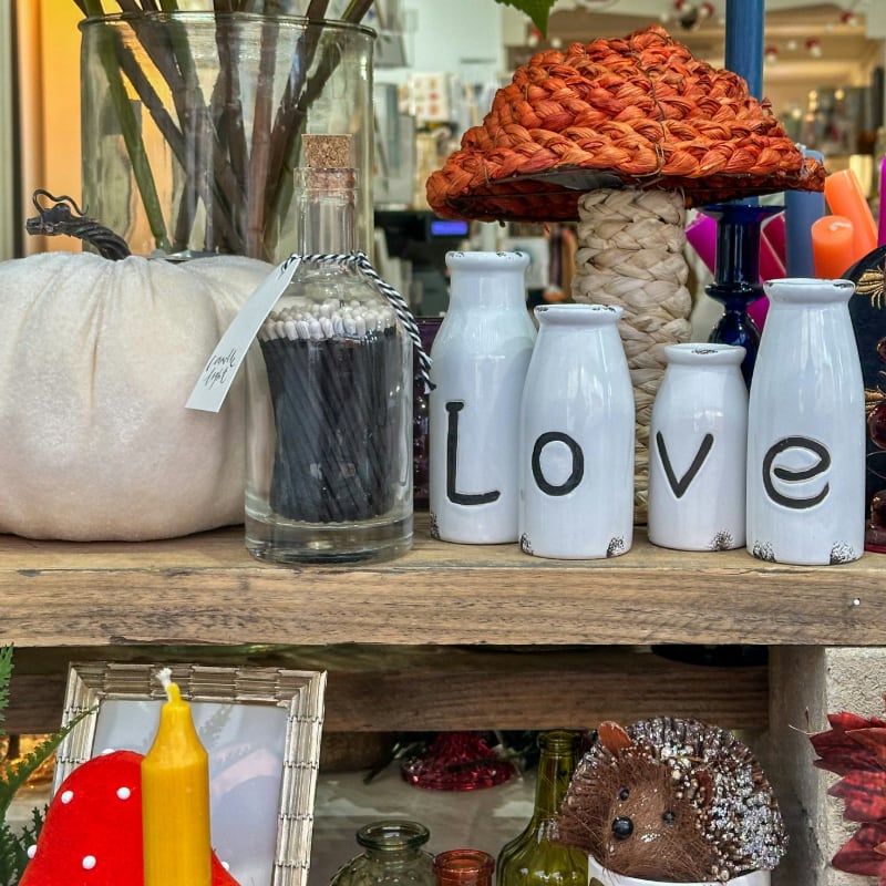 A shelf filled with lots of different types of items