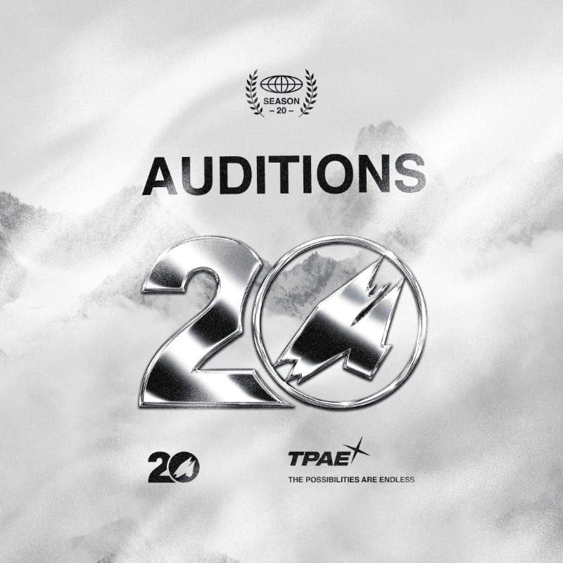 A large, metallic "20" with a stylized "4" inside a circle dominates the foreground against a misty, mountainous background with the word "AUDITIONS" and a laurel wreath logo above.