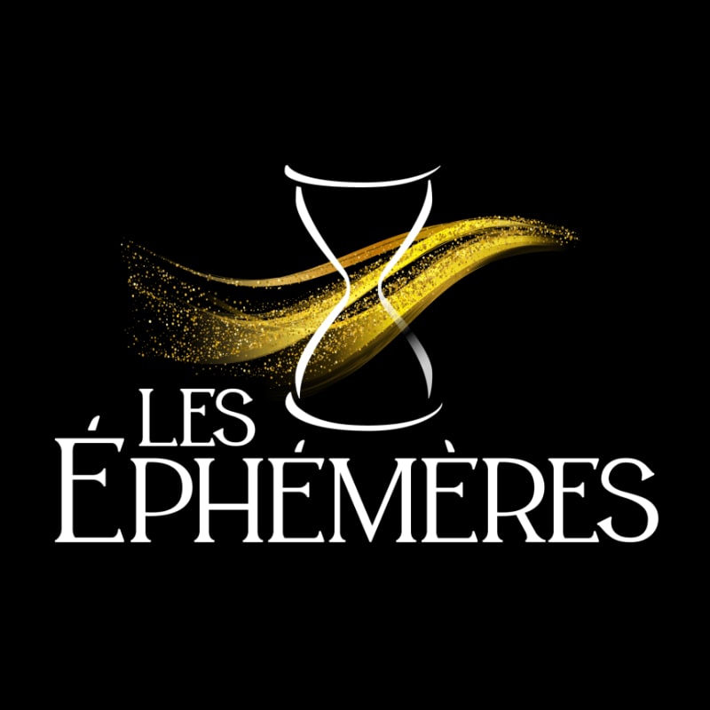 A white hourglass with a golden, sparkling wave flowing through it is centered above the white text "LES ÉPHÉMÈRES" on a black background.