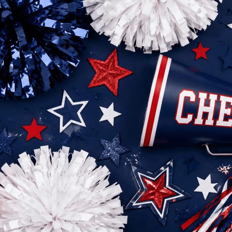 Red, white, and blue pom-poms and star cutouts are scattered around a megaphone in the foreground, against a dark blue background.