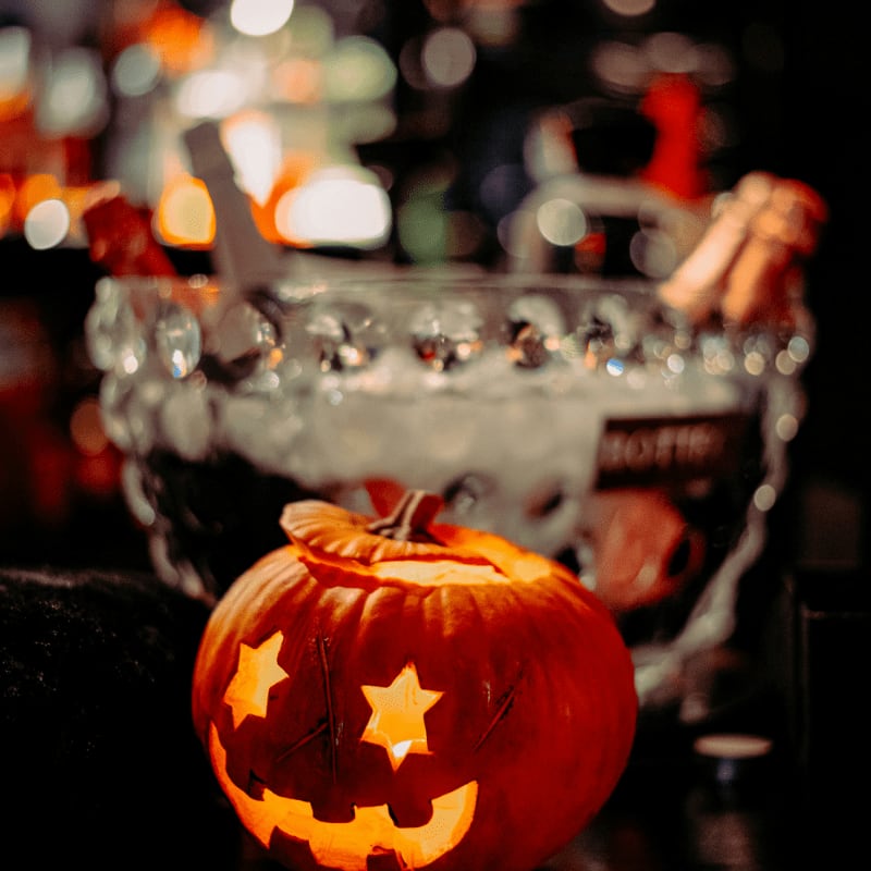 person holding jack o lantern