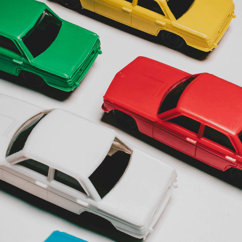a group of toy cars sitting on top of a table