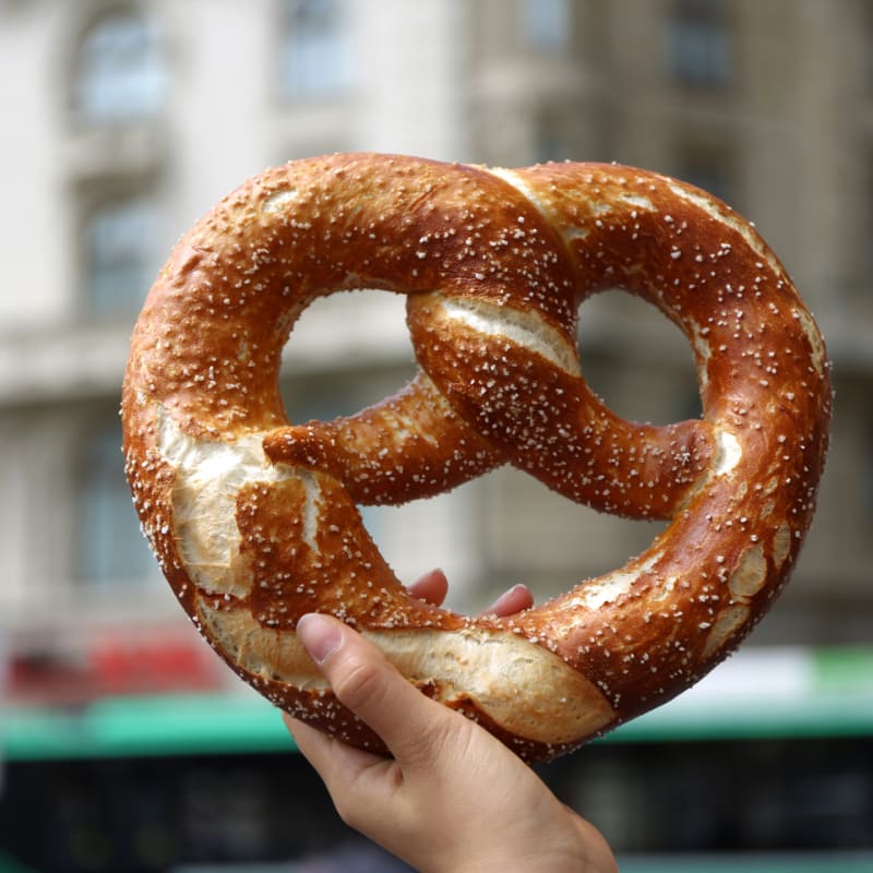 person holding pretzel