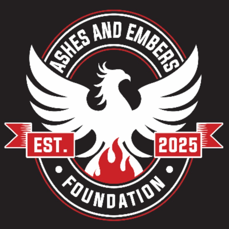 A white phoenix with outstretched wings rises from flames in the foreground, set against a circular emblem with the text "ASHES AND EMBERS FOUNDATION EST. 2025" in the background.