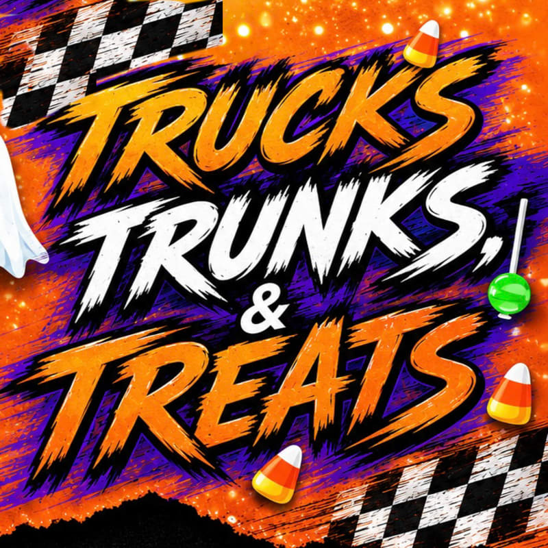 Candy corn and a ghost float in the foreground against a vibrant orange and purple background with a checkered flag pattern.