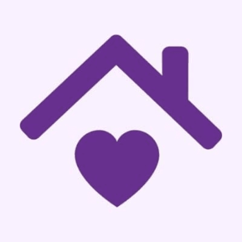 A purple heart rests beneath a purple house outline against a light purple background.