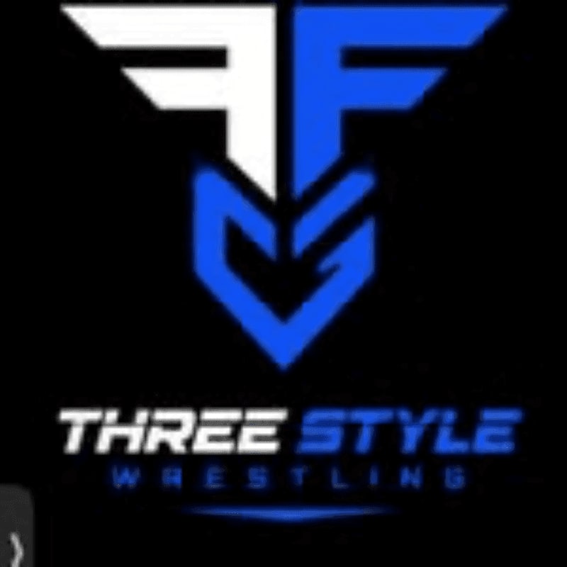 A stylized logo with the letters "FFG" in white and blue is centered on a black background, with the words "THREE STYLE WRESTLING" below it.