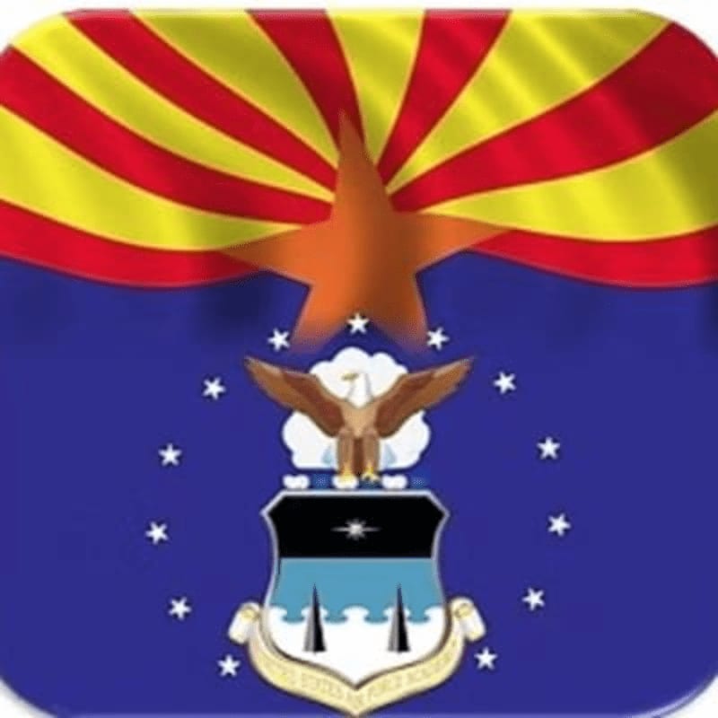 A stylized Arizona flag with a prominent copper star serves as the background for the United States Air Force emblem, featuring an eagle perched above a shield.