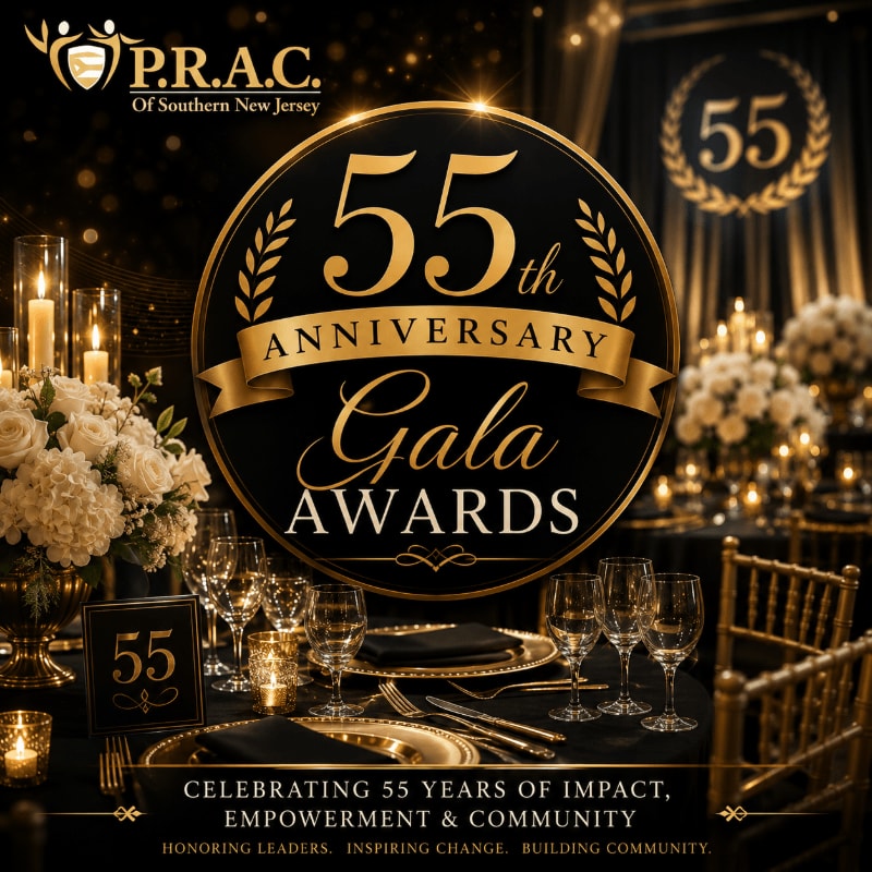 A formal gala setting with a table set for dinner in the foreground and a large circular emblem celebrating a 55th anniversary in the background.