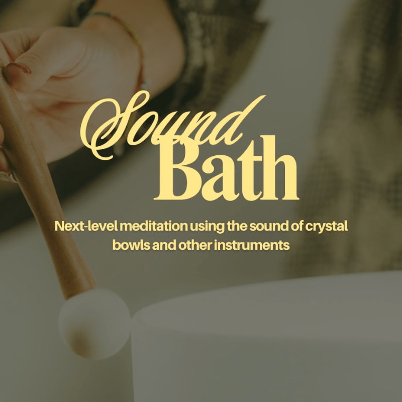 A hand strikes a crystal singing bowl in the foreground, with the words "Sound Bath" and descriptive text overlaying the blurred background.