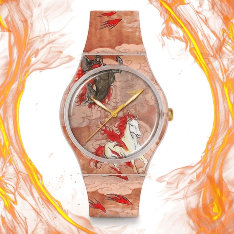 A Swatch watch with a design of galloping horses and fiery elements is framed by swirling orange flames.