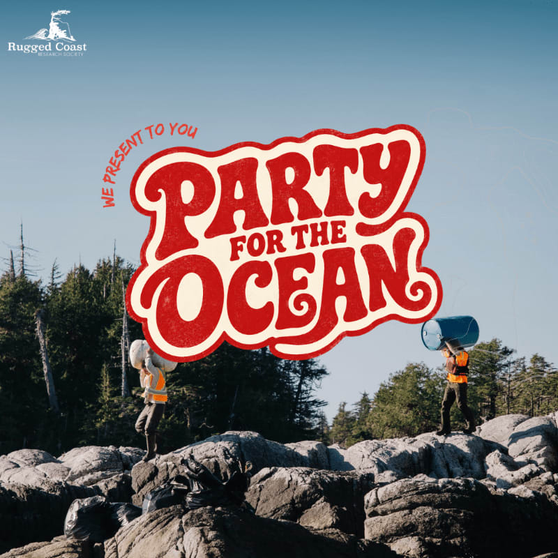 Two people in orange vests carry large blue barrels over rocky terrain in the foreground, with a "Party for the Ocean" logo superimposed over a background of trees and a clear blue sky.