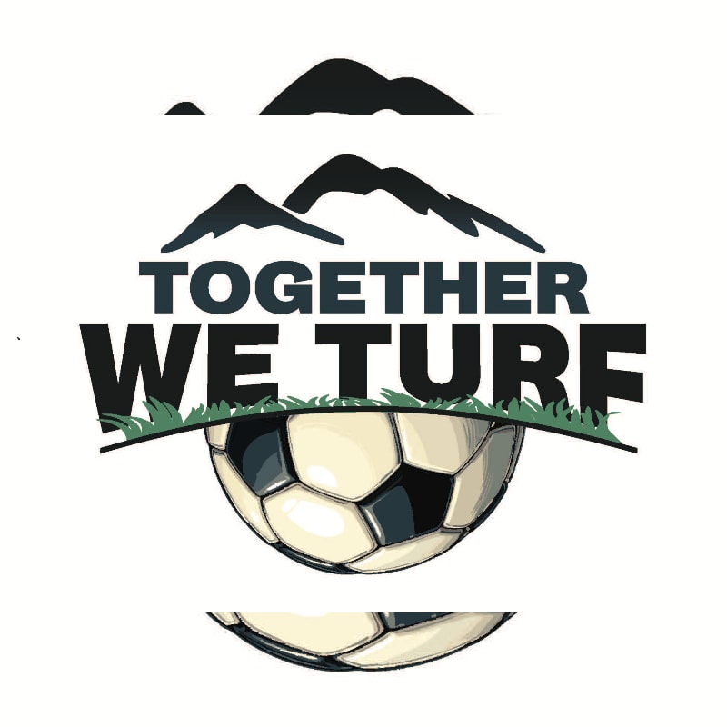 A soccer ball rests on grass in the foreground, with mountains silhouetted against a white background in the upper portion of the image.