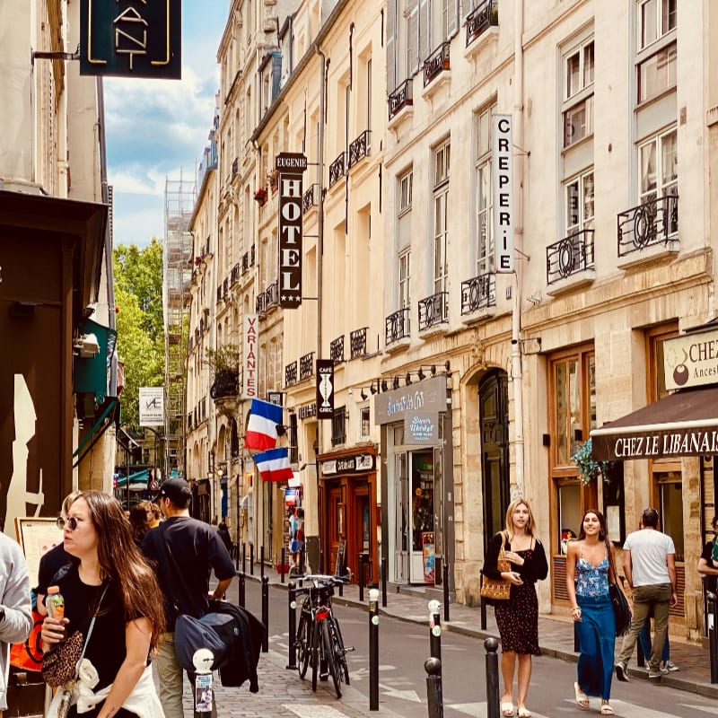 people walking on a sidewalk