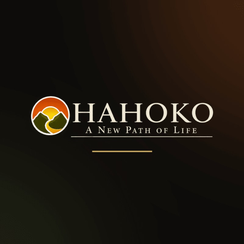 A circular logo with mountains and a sun is to the left of the word "HAHOKO" and the tagline "A New Path of Life" against a dark, gradient background.