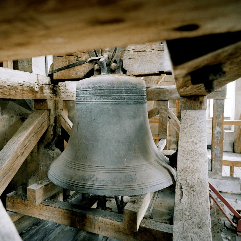 a bell on a wooden structure