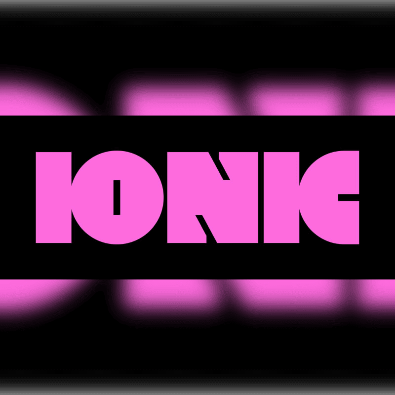 A black banner with the word "IONIC" in large pink block letters is centered against a blurred pink and black background.