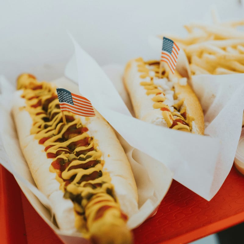 closeup photo of two hotdogs on tray