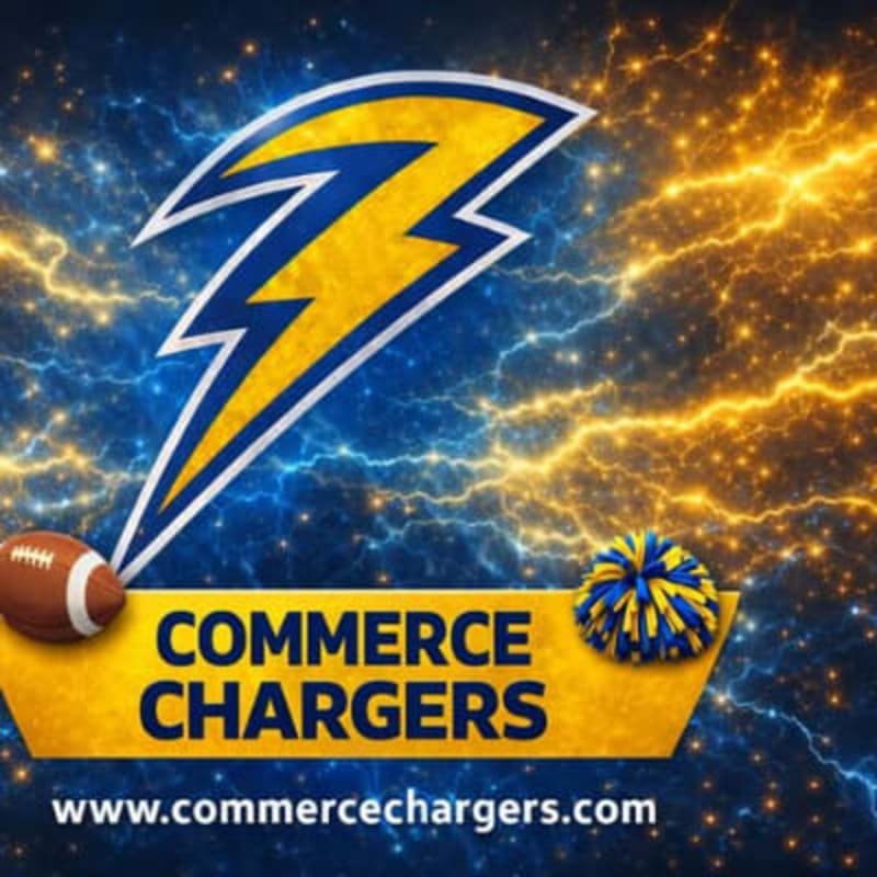 A football and a pom-pom rest on a yellow banner with "COMMERCE CHARGERS" and a website address, set against a dramatic background of blue and orange lightning.