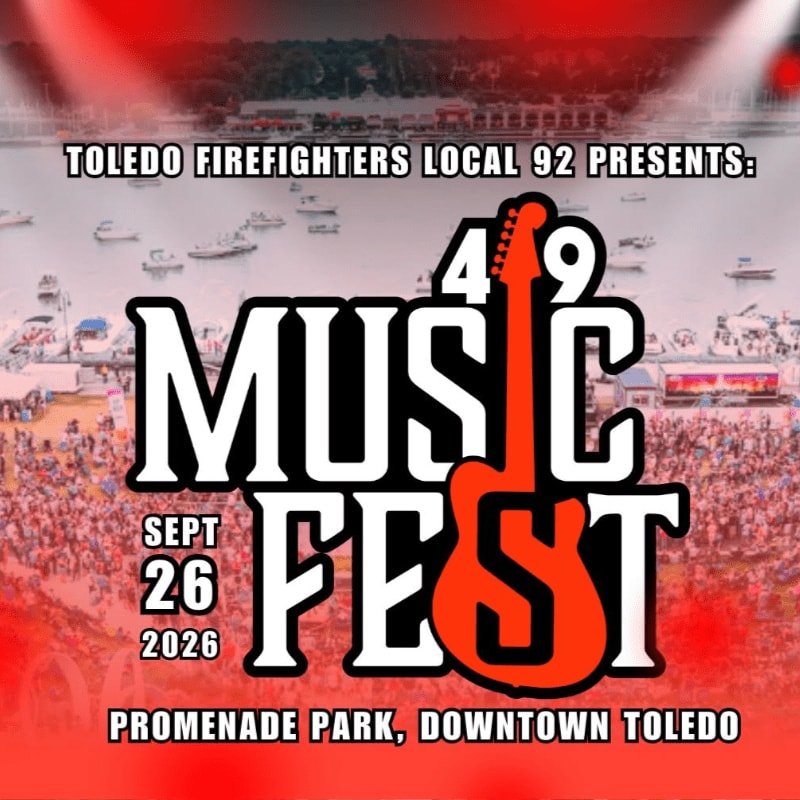 A large crowd gathers in Promenade Park, Downtown Toledo, for the Toledo Firefighters Local 92's 49th Music Fest on September 26, 2026, with a vibrant red and white graphic featuring a guitar dominating the foreground.