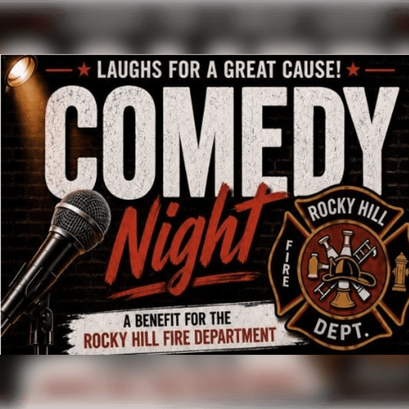 A microphone stands in the foreground before a brick wall background advertising a "Comedy Night" benefit for the Rocky Hill Fire Department.