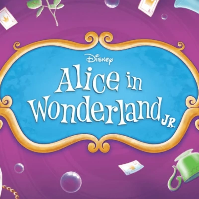 A purple background with floating playing cards, bubbles, and a teacup frames the "Alice in Wonderland Jr." title in a golden, ornate frame.