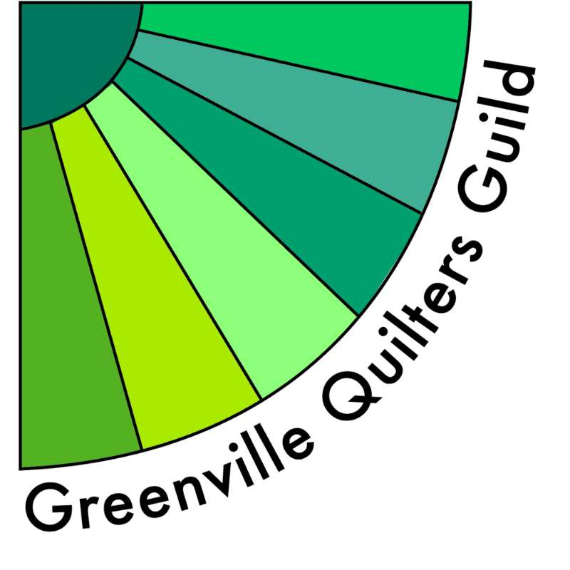 A fan of green fabric segments forms the foreground, with the words "Greenville Quilters Guild" curving around it against a white background.