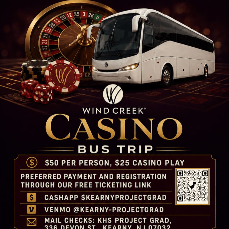 A white casino bus is parked next to a roulette wheel, dice, and casino chips on a casino floor.