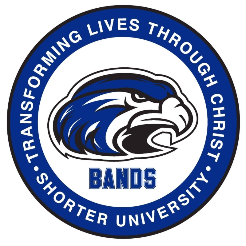 A blue and white eagle head logo with "BANDS" in blue text is centered within a blue circle that reads "TRANSFORMING LIVES THROUGH CHRIST • SHORTER UNIVERSITY" in white text.