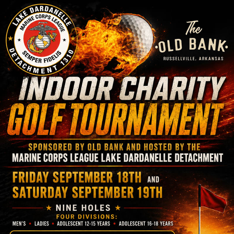 A fiery golf ball flies towards the viewer in the foreground, with a red flag and text advertising an indoor charity golf tournament sponsored by The Old Bank and hosted by the Marine Corps League in the background.
