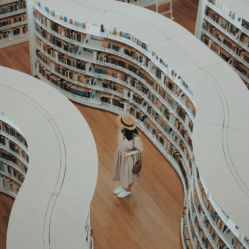 woman standing on bookstore