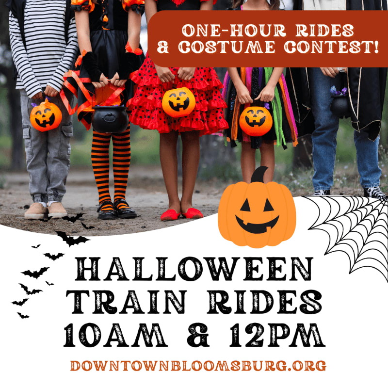 Children in Halloween costumes holding candy buckets stand in the foreground with a pumpkin and spiderweb graphic, while a banner announcing "ONE-HOUR RIDES & COSTUME CONTEST!" is visible in the background.
