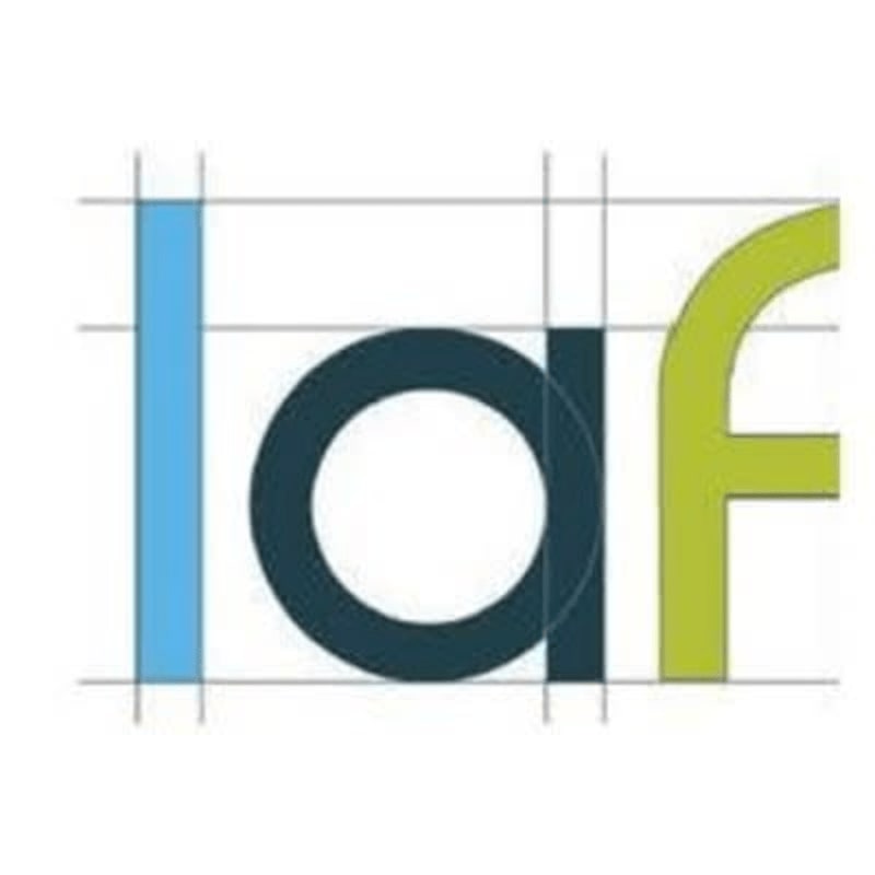A blue vertical bar, a dark blue circle with a white center, and a lime green curved stroke form the letters "laf" against a white background with thin gray grid lines.