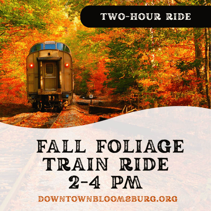 A train travels through a vibrant autumn forest, with text overlaying the scene advertising a "Fall Foliage Train Ride."
