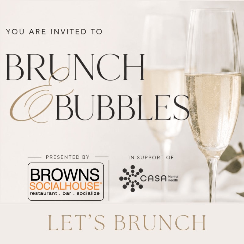 Two champagne flutes filled with bubbly are in the background, while the foreground displays text announcing a "BRUNCH & BUBBLES" event presented by Browns Socialhouse in support of CASA Mental Health.