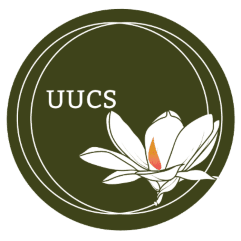 A white magnolia flower with a fiery center is depicted in the foreground against a dark green circular background with the letters "UUCS" in white.