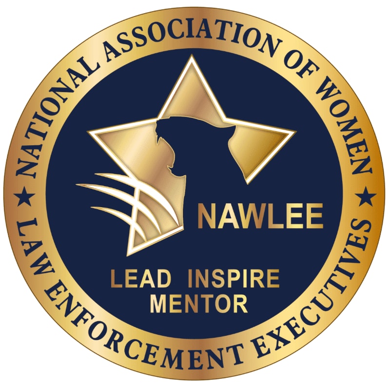A gold-rimmed circular emblem with a dark blue background features a gold star with a silhouetted panther's head and claws in the foreground, and the text "NATIONAL ASSOCIATION OF WOMEN LAW ENFORCEMENT EXECUTIVES LEAD INSPIRE MENTOR" encircling the emblem.