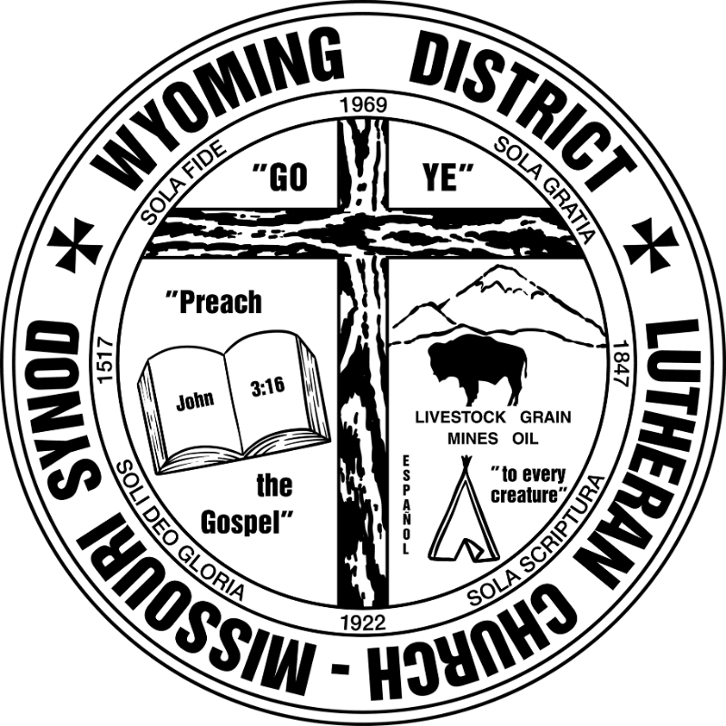 A circular emblem features a Bible and a buffalo in the foreground, set against a backdrop of mountains and a cross within a ring of text.