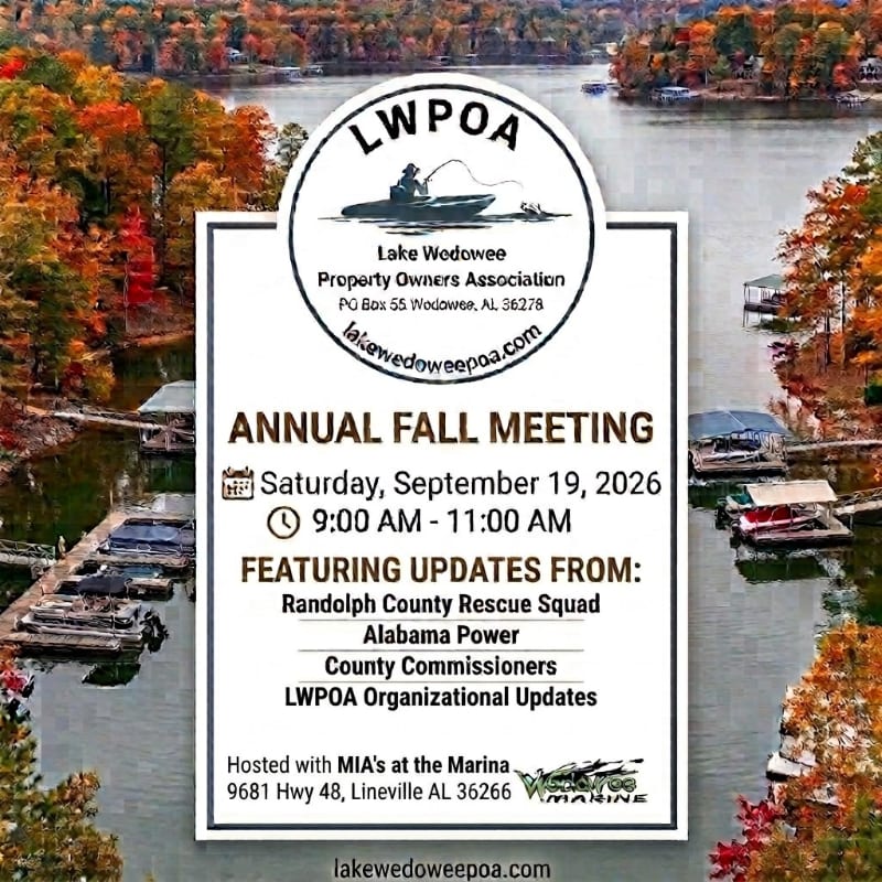 A flyer for an annual fall meeting is superimposed over a scenic autumn view of a lake with boats docked along the shore.