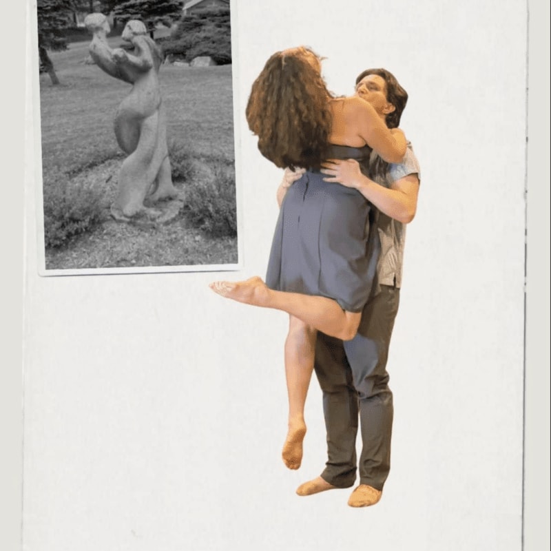 A couple embraces in the foreground, while a black and white photograph of a statue in a park is pinned in the background.