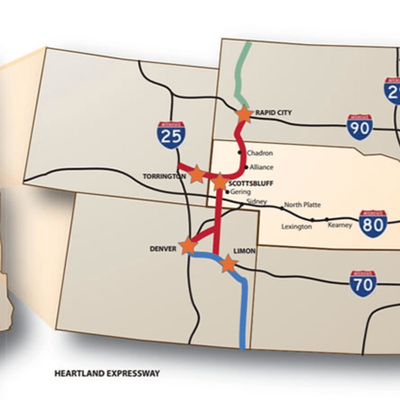 A map highlights the Heartland Expressway route in red, connecting cities like Denver and Rapid City, with interstate highways forming the background.
