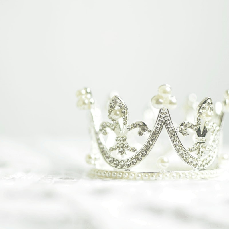 shallow photography of silver-colored crown