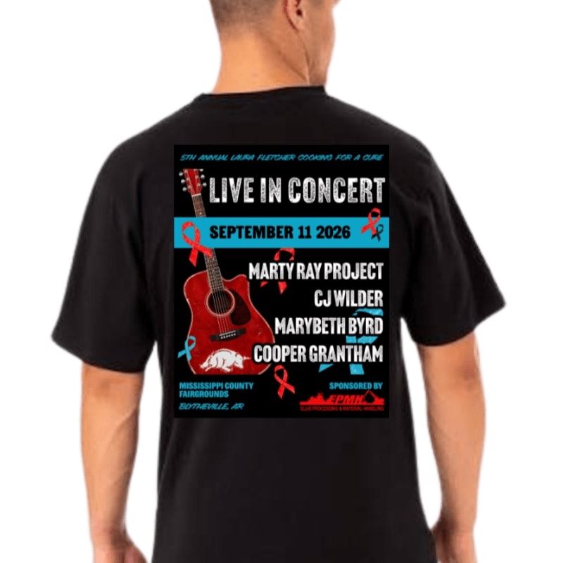 A black t-shirt displays a concert poster featuring an acoustic guitar and red ribbons in the foreground, with the event details and sponsor information in the background.