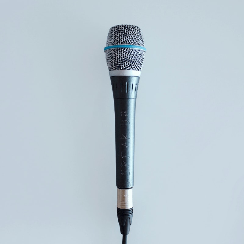 black and gray corded microphone