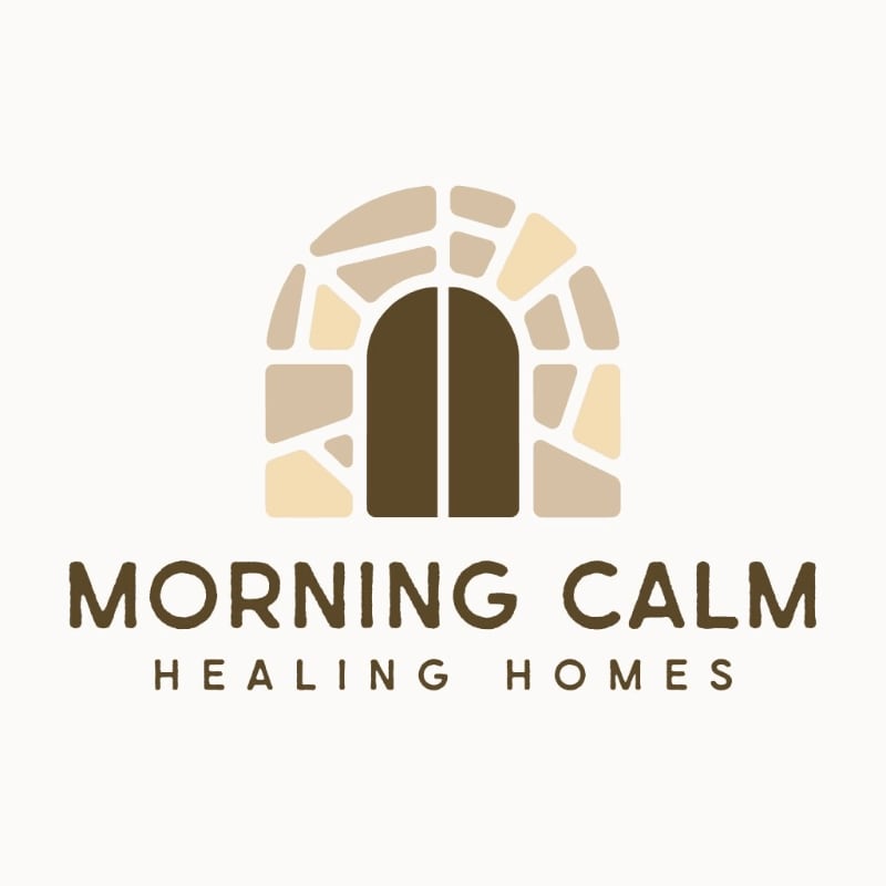 A stone archway with a dark double door stands in the foreground, above the text "MORNING CALM HEALING HOMES" on a light beige background.
